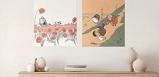 Two framed art posters hang side-by-side